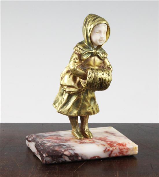 Georges Omerth (French, fl.1895-1925). A gilt bronze cold painted and ivory figure of a young girl, overall 6in.